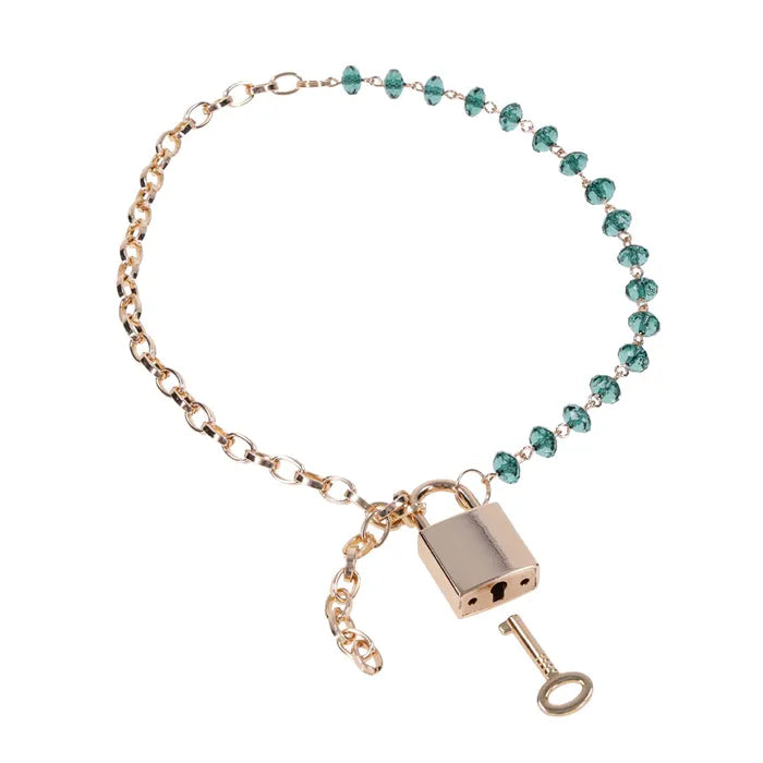 Sportsheets Sex & Mischief Indica Crystal Day Lockable Collar Gold / Emerald Sportsheets